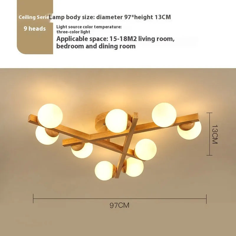 Scandinavian wooden-style ceiling light with three adjustable black lamp heads on angled arms