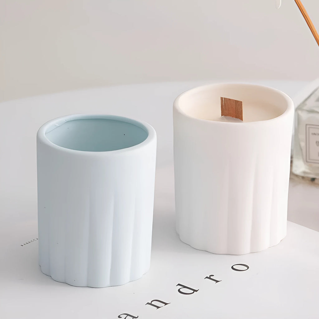 Minimalist ceramic round candlestick with relief pattern on a dining table