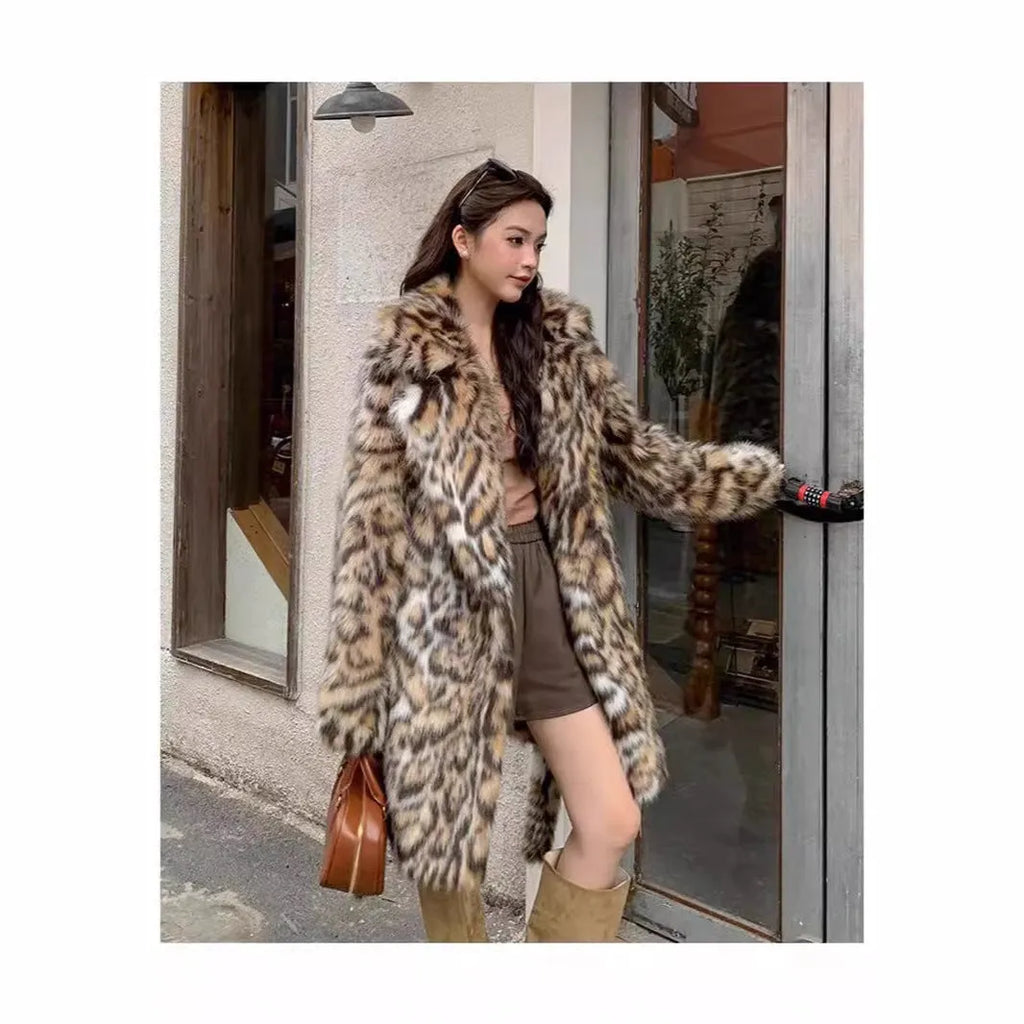 Long faux fur coat with a textured fox fur collar and side pockets.