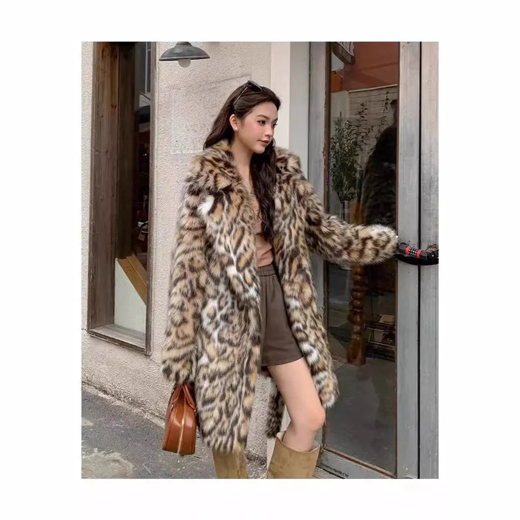 Long faux fur coat with a textured fox fur collar and side pockets.