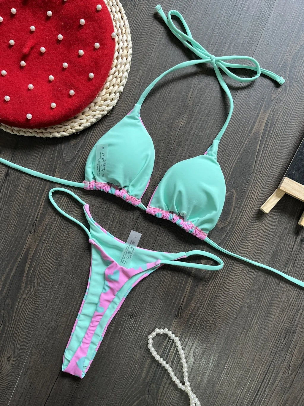 Women's heart print backless swimsuit in briefs style with cotton lining.