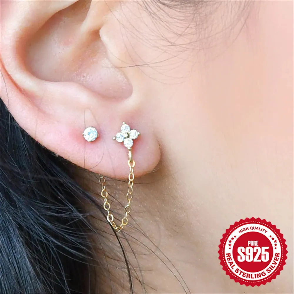 S925 sterling silver stud earrings with a diamond flower and tassel chain design in an electroplated gold finish.