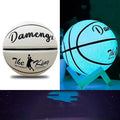 Luminous outdoor basketball with soft PU leather cover in glowing blue colour on outdoor court