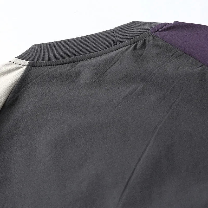 Dark grey loose fit t-shirt with raglan sleeves and contrast colour details.