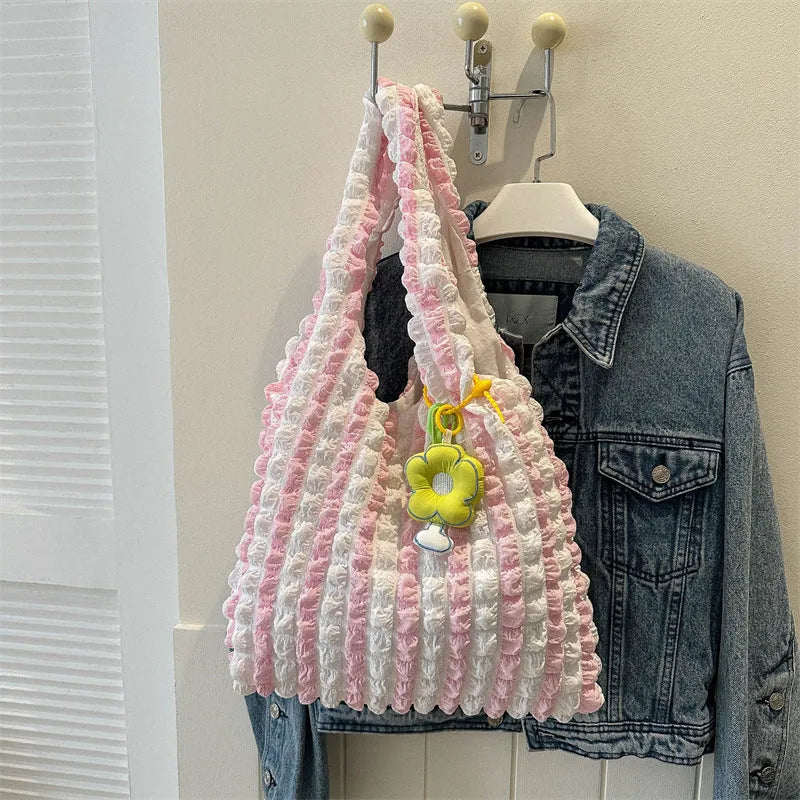 Women's soft pleated bubble shoulder bag in a vertical square shape with a detachable pendant charm.