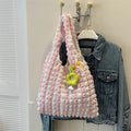 Women's soft pleated bubble shoulder bag in a vertical square shape with a detachable pendant charm.