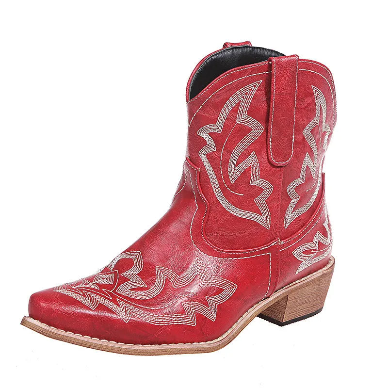Women's blue embroidered Western ankle boots with a low wedge heel and pointed toe