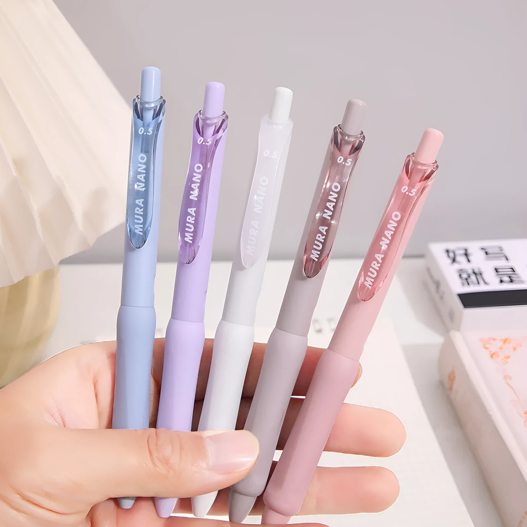 Macaron colour press gel pen with 0.5mm tip showing smoked ink refill options