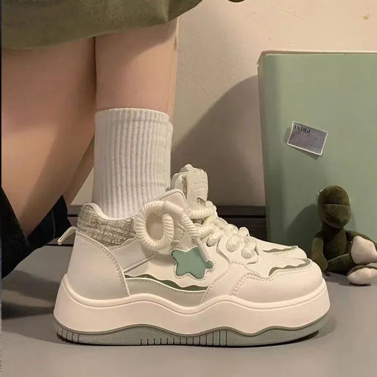 Women's green patent leather platform sneakers with round toe and lace-up closure