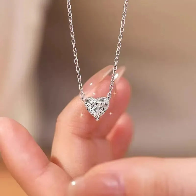 Women's simple silver-coloured heart necklace on a delicate chain.