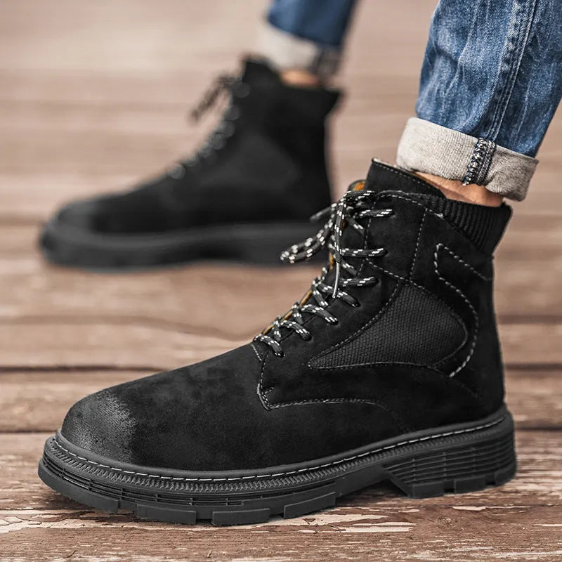 Men's brown frosted leather Martin boots with thick rubber sole on a wooden floor.