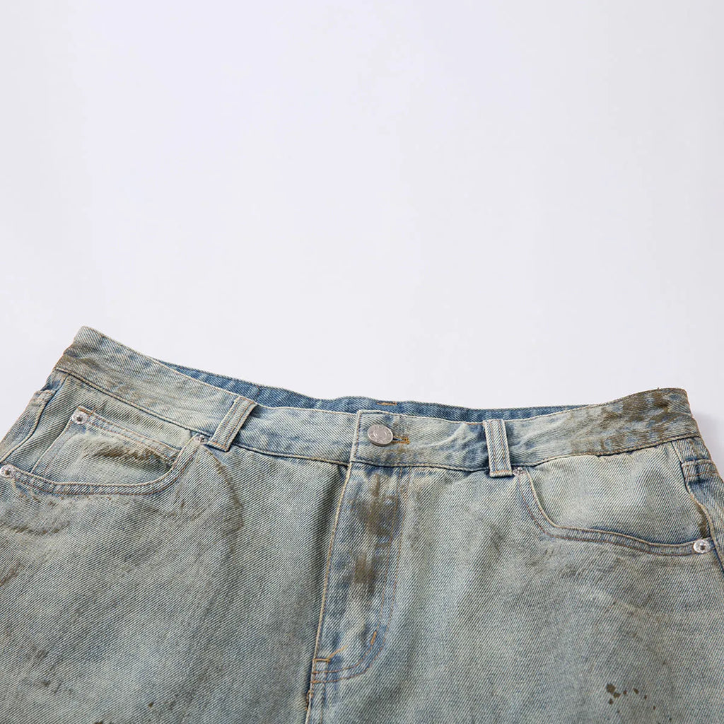 Blue cropped washed denim middle pants with a straight leg and zipper fly on a model.