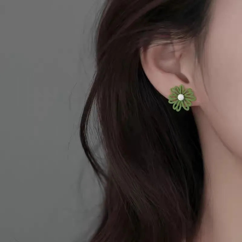 Little Summer alloy flower stud earrings in blue and orange, white and green, and yellow and white colour options.