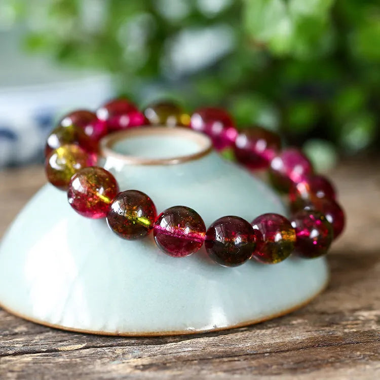 Handmade watermelon crystal bracelet showing natural colouration and bead detailing