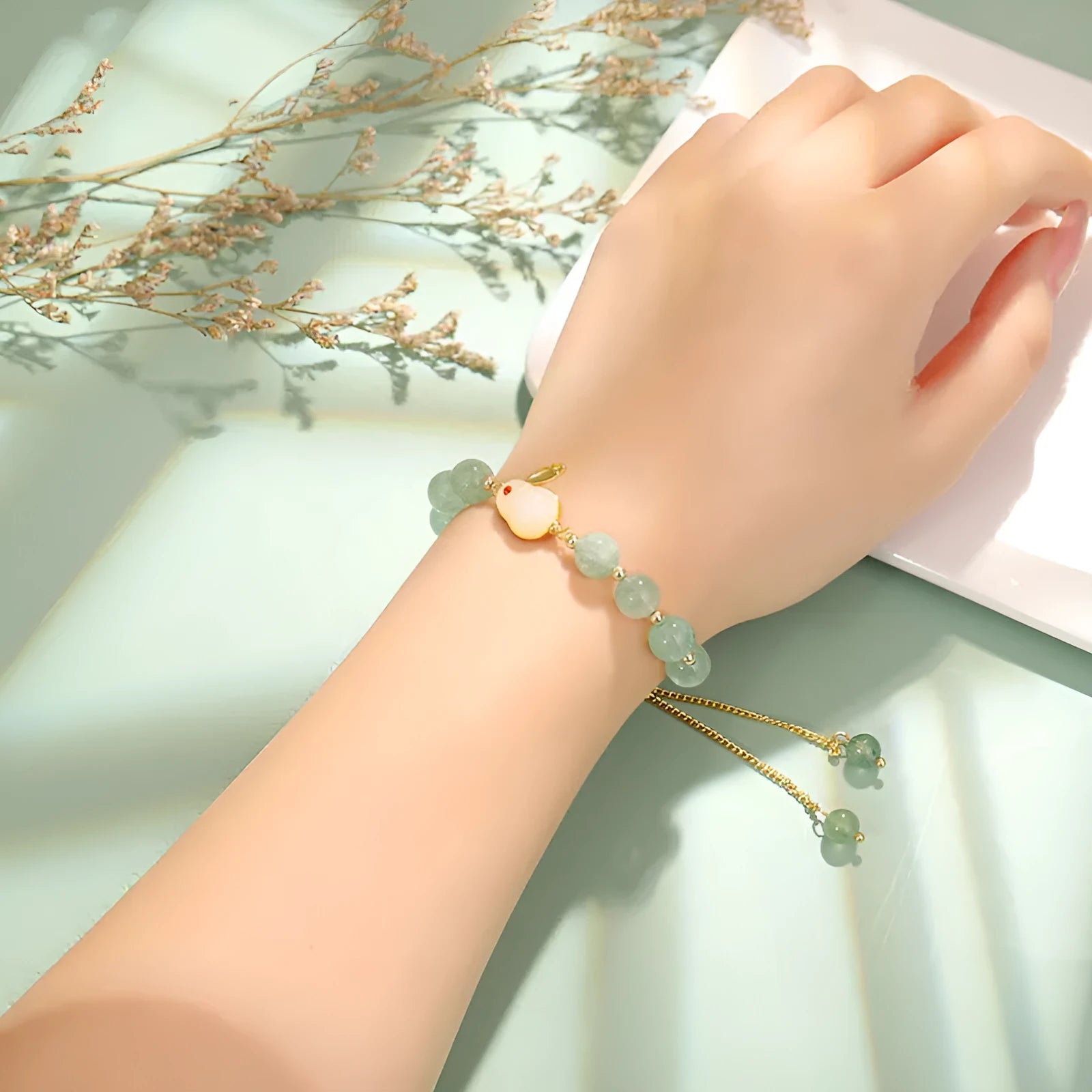 Rabbit bracelet with green aventurine and strawberry quartz beads, copper and gold-plated details