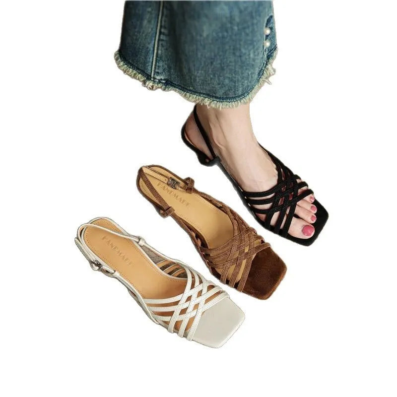 Beige retro women's sandals with thin crossing straps, an ankle buckle, and a 3-6cm mid-heel on a rubber sole.