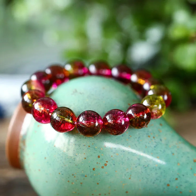 Handmade watermelon crystal bracelet showing natural colouration and bead detailing