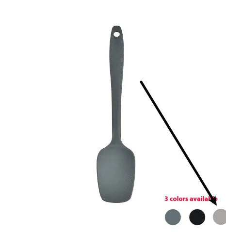 Black silicone kitchen utensil set with 12 tools stored in a rotating plastic storage bucket on a worktop.