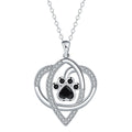 Gold necklace with cat and dog paw prints pendant on cross chain