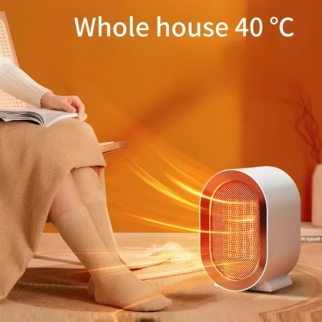 A compact black desktop ceramic fan heater with mechanical control dials.