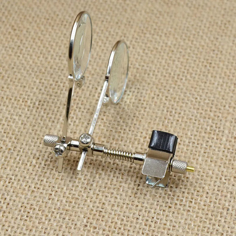 Auxiliary reading glass mirror double clip with metal bracket and glass lens.