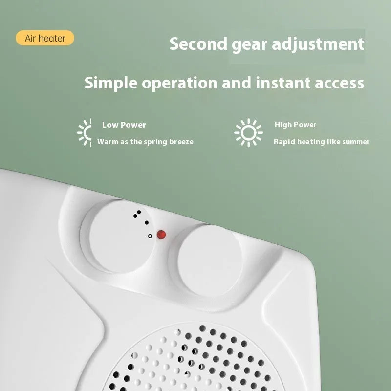 Small white portable electric heater with control dials on a desktop.