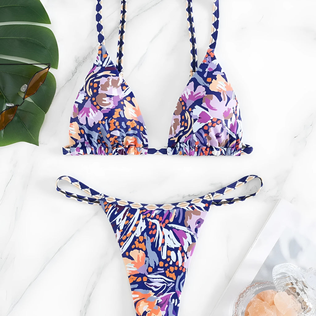 Women's floral print triangle bikini swimsuit with adjustable tie sides on white background
