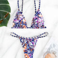 Women's floral print triangle bikini swimsuit with adjustable tie sides on white background