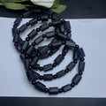 Natural black tourmaline rough stone bracelet with polished beads on wrist