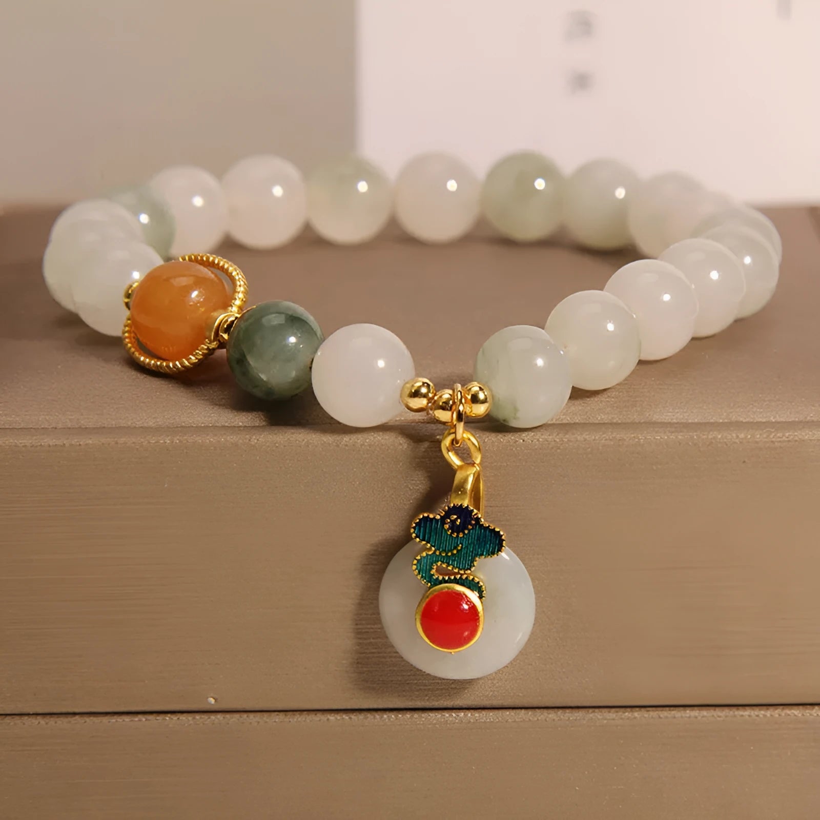 Women's ice jade bracelet with pearl accents and carved jade buckle clasp