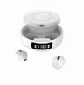 Black wireless semi-in-ear headphones and charging case on a table, showing compact design.
