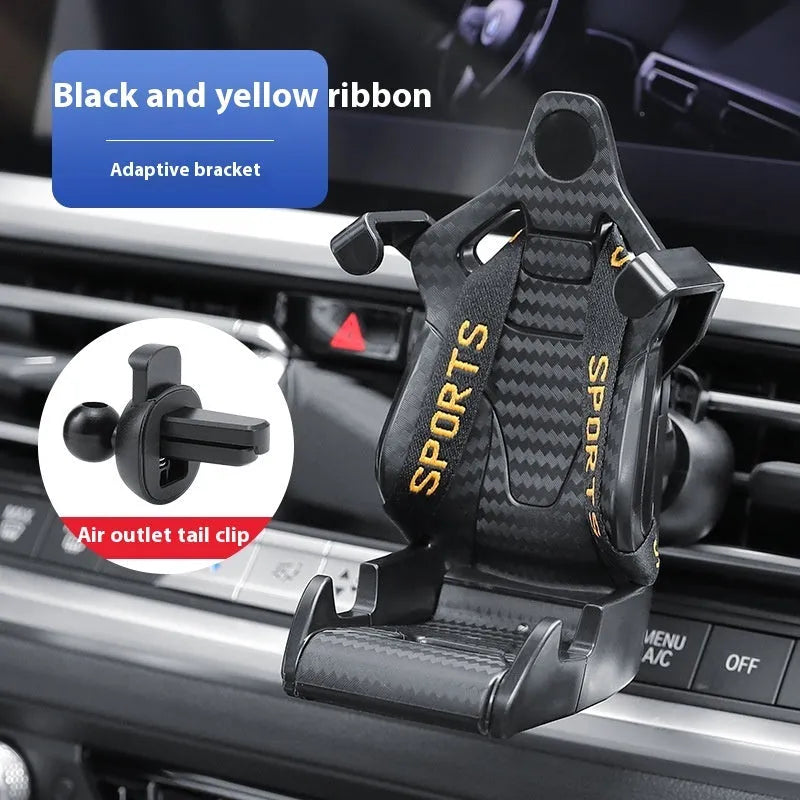Gold car air vent phone holder with racing seat shape mounted on a car vent, showing 360-degree rotation.