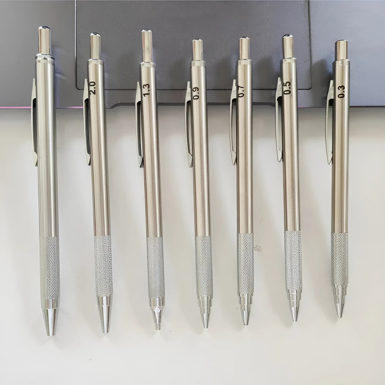 Metal automatic mechanical pencil with multiple lead size options including 0.5mm and 2.0mm diameters