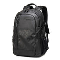 Blue plaid 18 inch laptop backpack with curved shoulder strap showing front pocket.