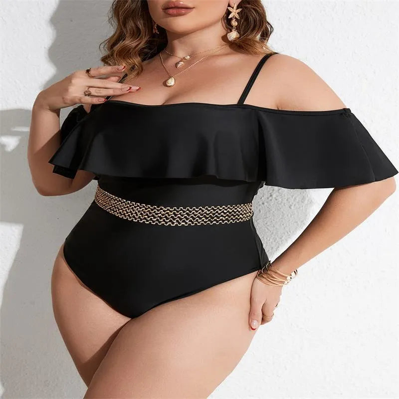Black women's one-piece swimsuit on a hanger, plus size range 0XL to 4XL.