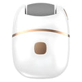 White electric foot grinder with ergonomic handle, debris suction port, and adjustable speed control on a table top