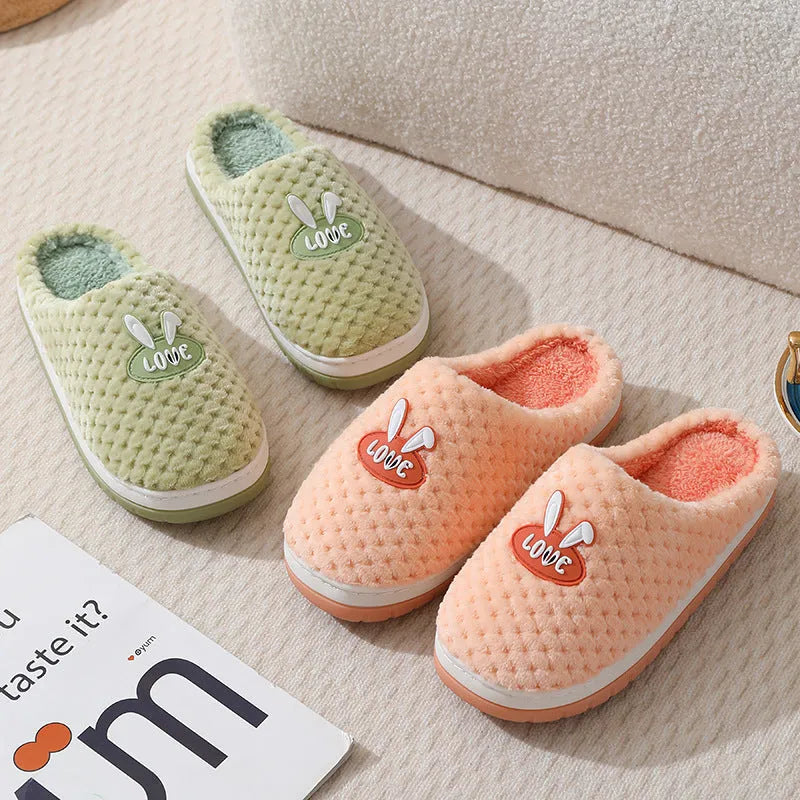 Women's rabbit plaid artificial fur house slippers with a flat heel and rubber sole, shown in apricot colour.