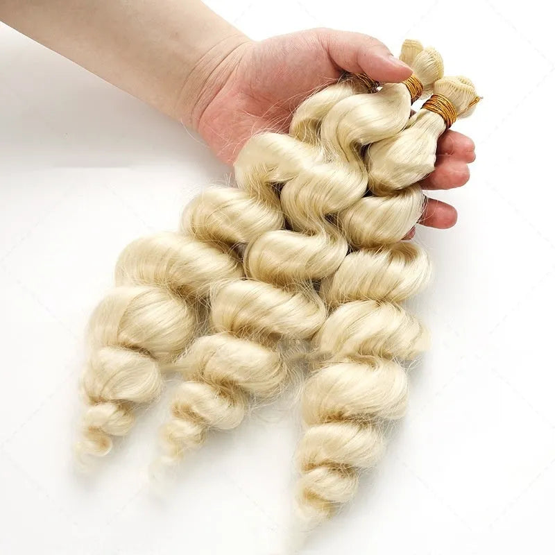 Golden blonde synthetic weft wig for women, shown in long style.