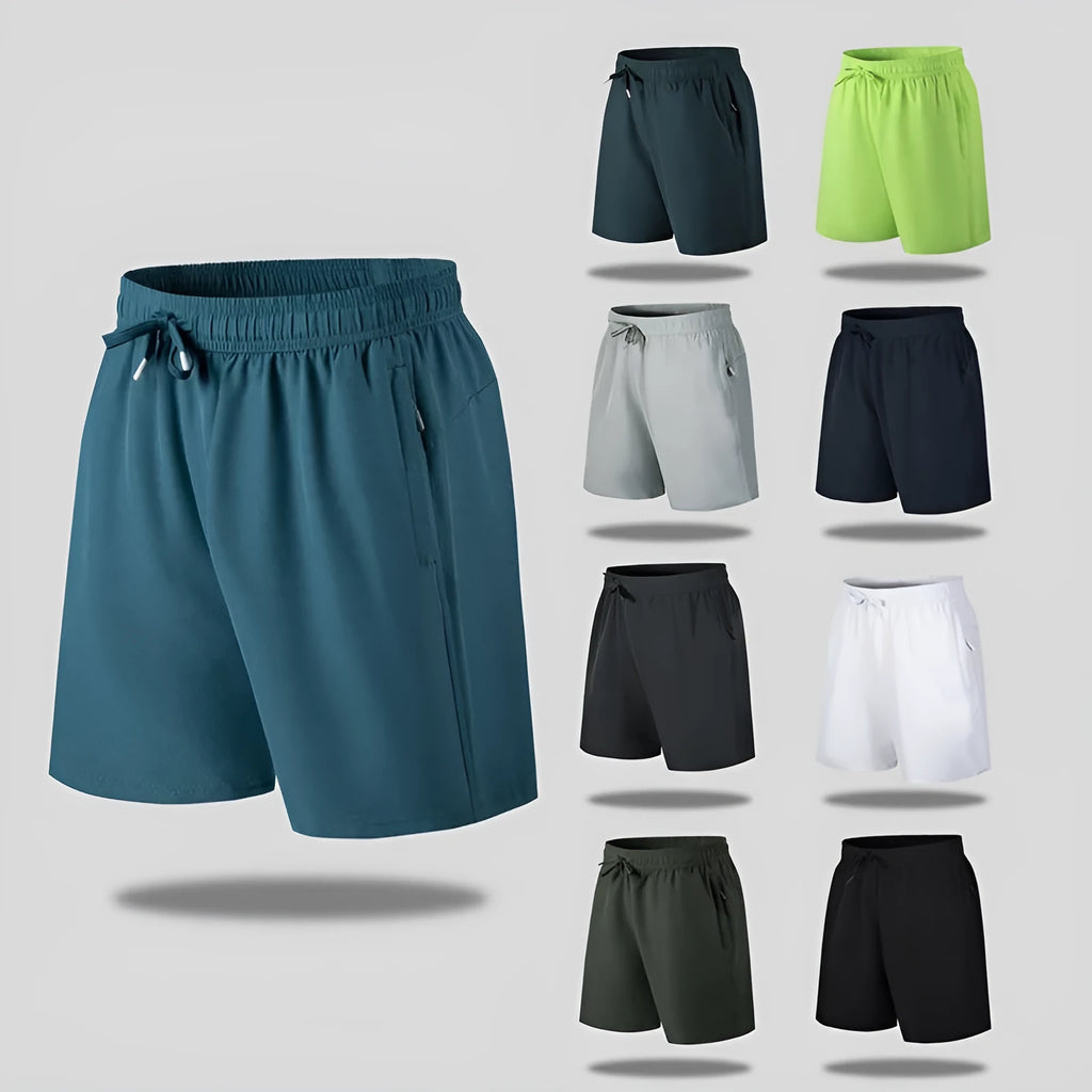 Man wearing loose-fit black quick-drying ice silk polyester beach shorts with an elasticated waist.