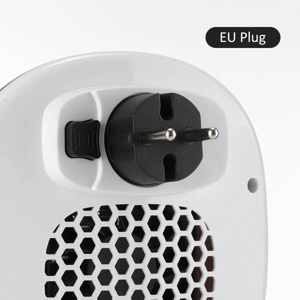 White plastic ceramic heating electric blower heater with remote control on a table.