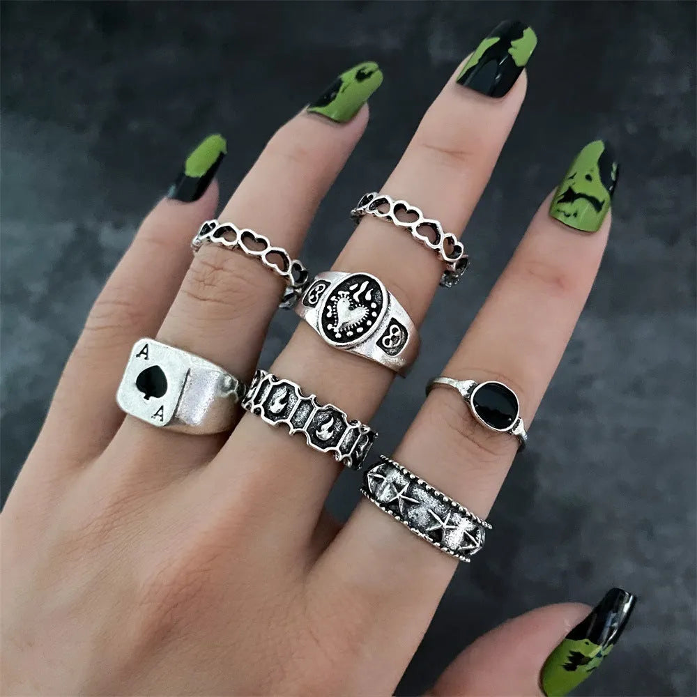 Alloy ring set with butterfly and snake retro geometric designs on display