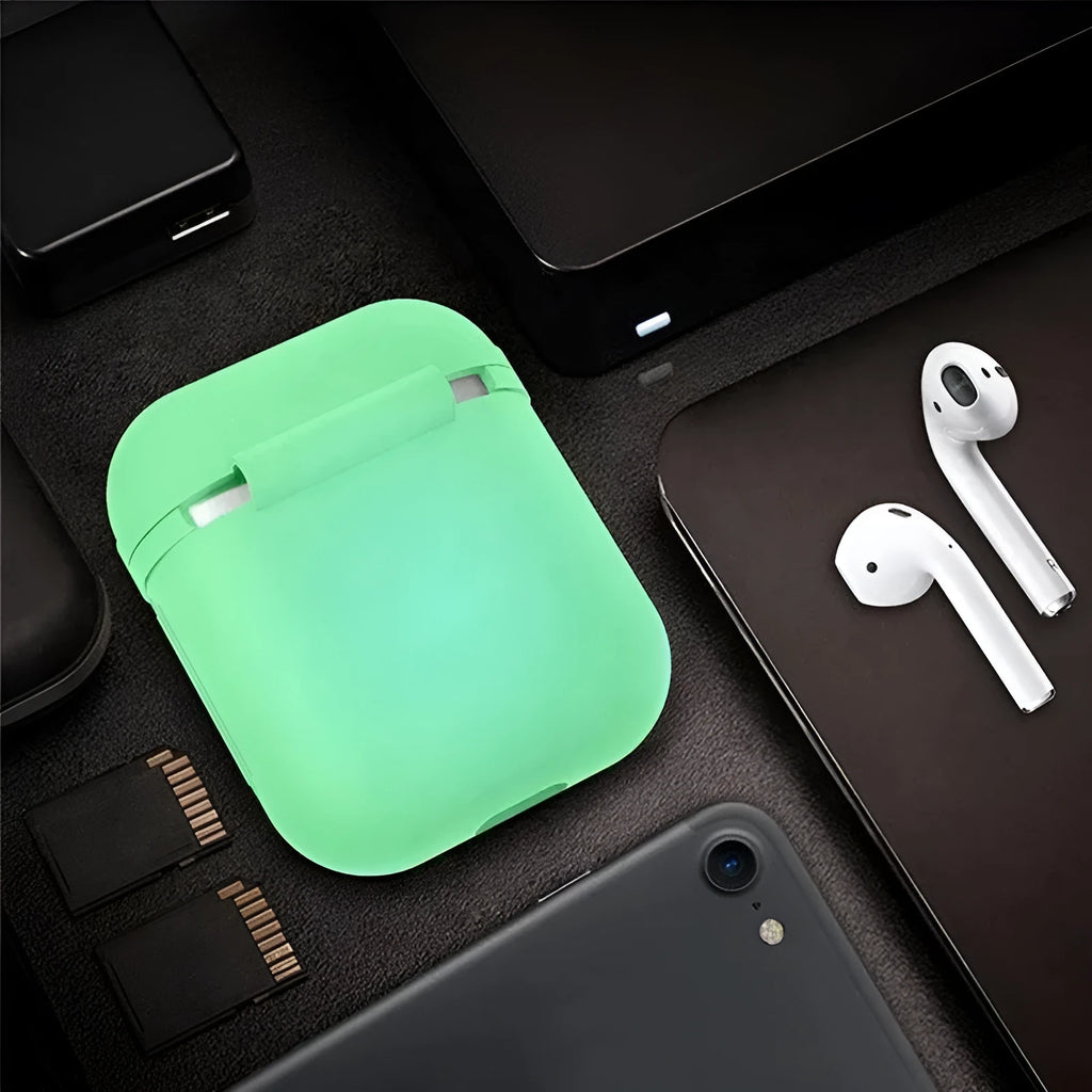 Luminous glow-in-the-dark silicone flip-top protective case for Apple AirPods on a dark background