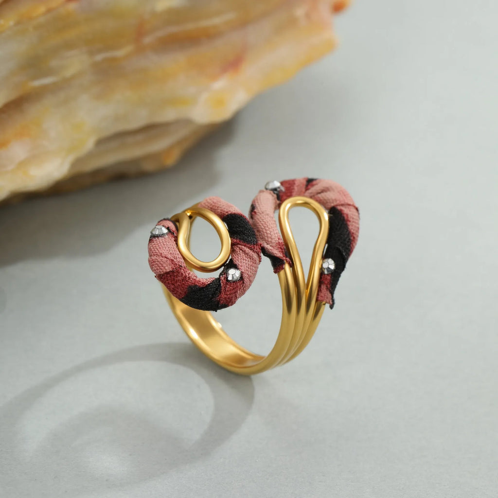 Geometric open mouth ring with leopard print design in electroplated stainless steel showing adjustable free-size construction