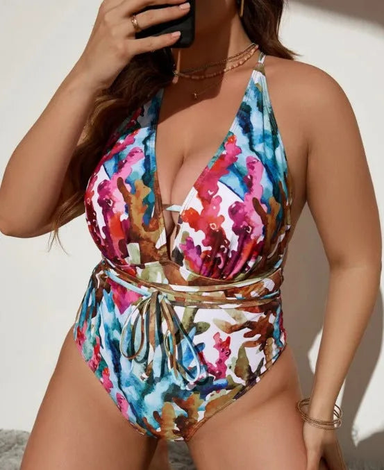 Solid purple women's one-piece halter swimsuit with brief style on a mannequin