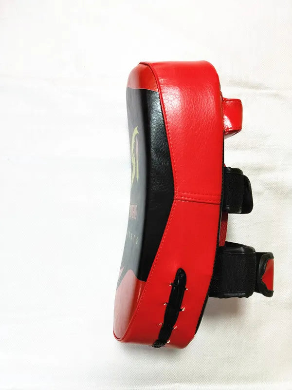 Black with red edges PU leather hand-held boxing target pad showing adhesive buckle strap.