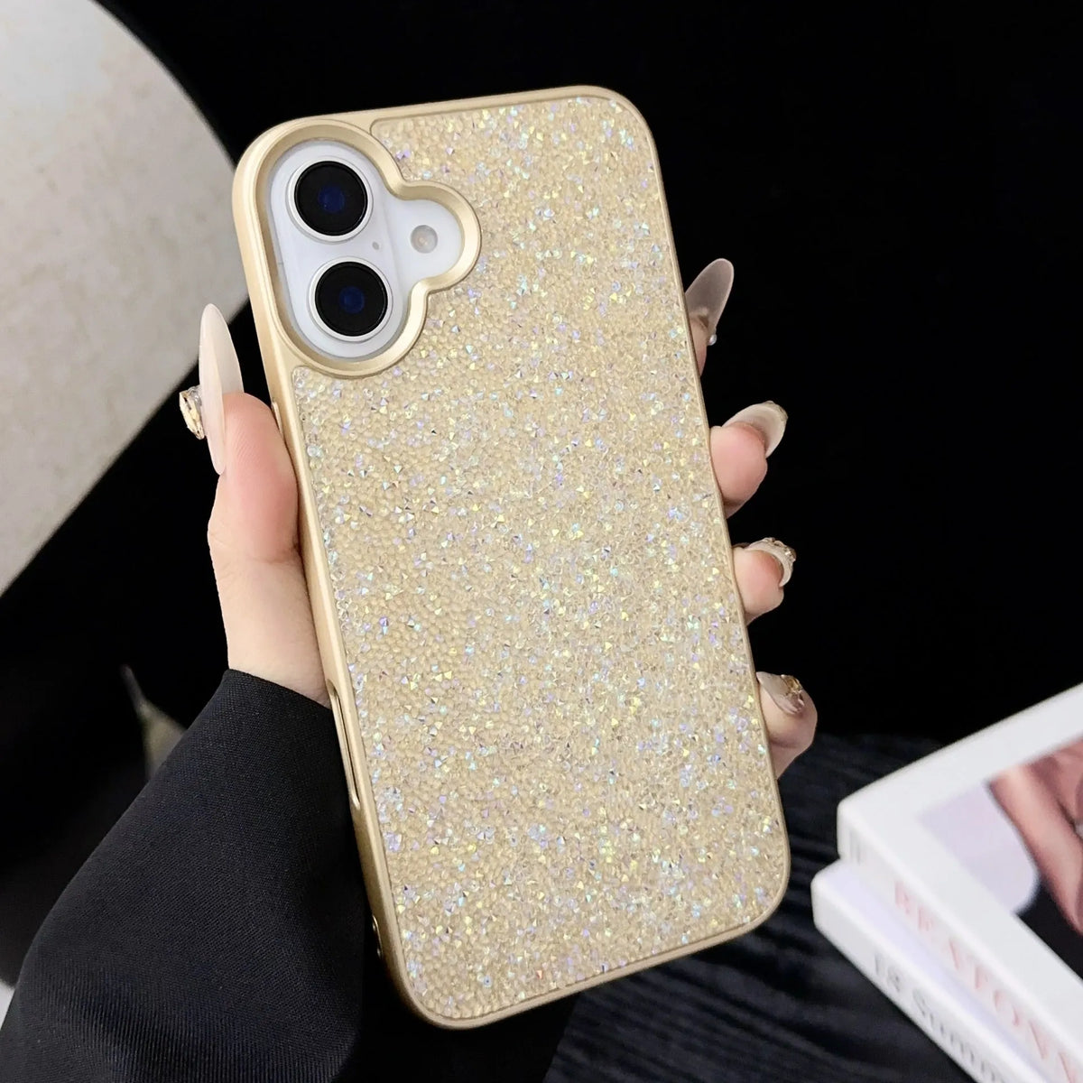 Skin Feeling Carbink iPhone 14 Pro phone case with large hole, soft edge, hard shell, and rhinestones in pink