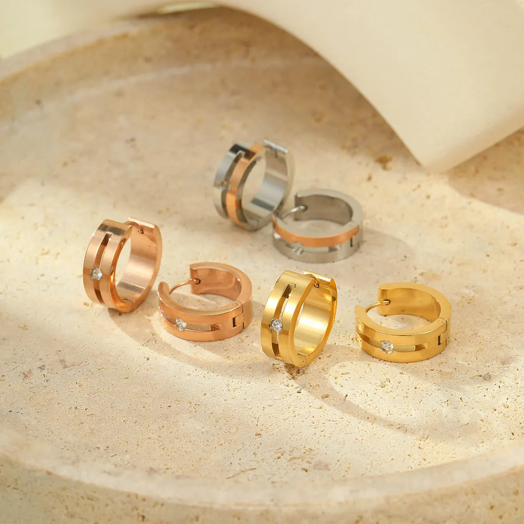 Pair of geometric diamond ear clips in 18K electroplated stainless steel, shown in gold, colour matching, and rose gold options