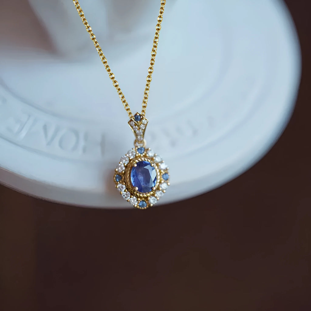 Huitan yellow gold necklace with adjustable chain and sparkling inlaid zircon gem pendant on a model.