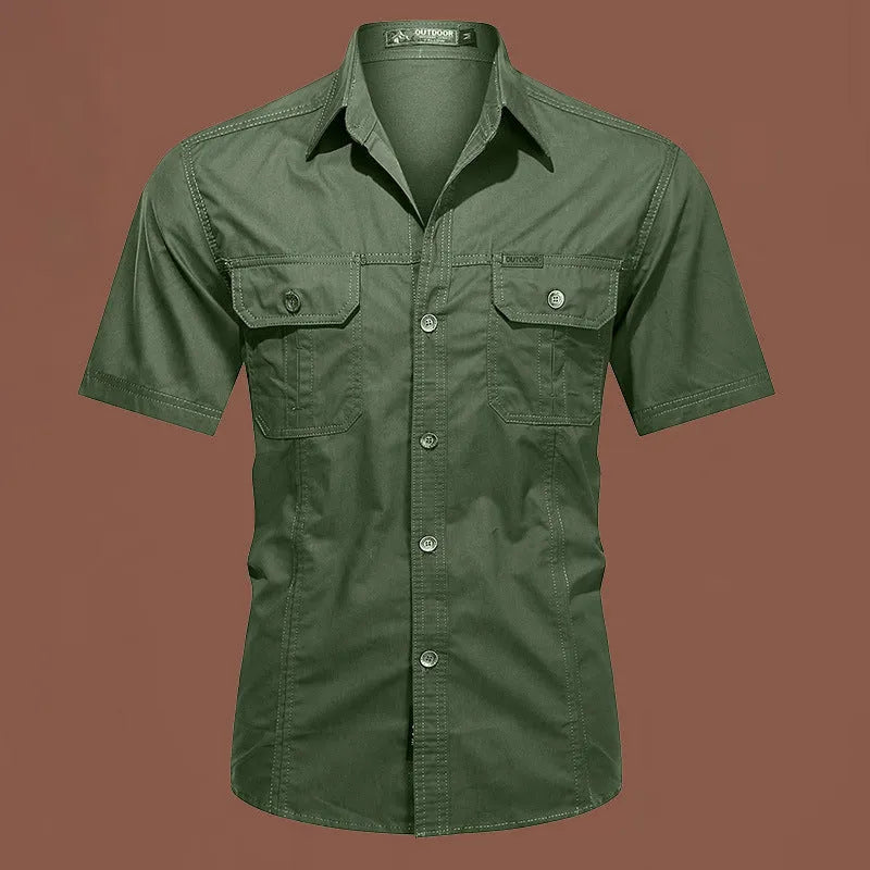 Man wearing a loose-fitting short sleeve cotton work shirt in a cardigan style.