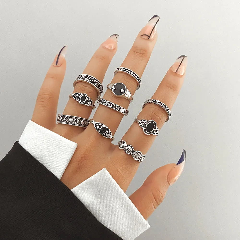 Alloy ring set with butterfly and snake retro geometric designs on display